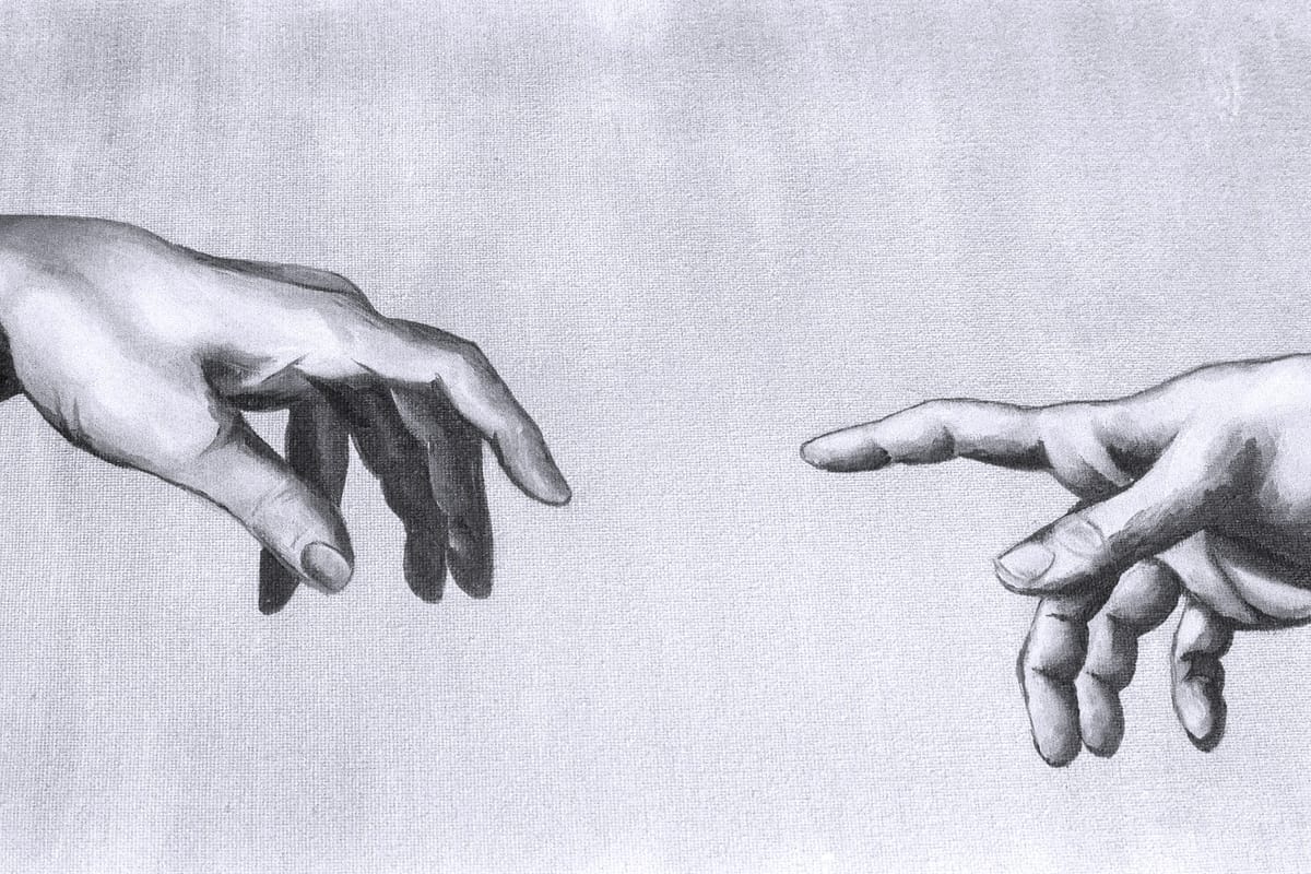A grayscale photo of two human hands reaching out to touch.
